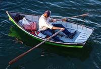 Fisherman in Dinghy, Madeleine Point - click to view larger image...